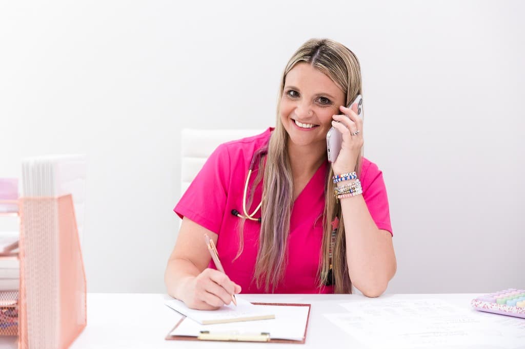 Dr. Dana Eyerly on a call at her desk